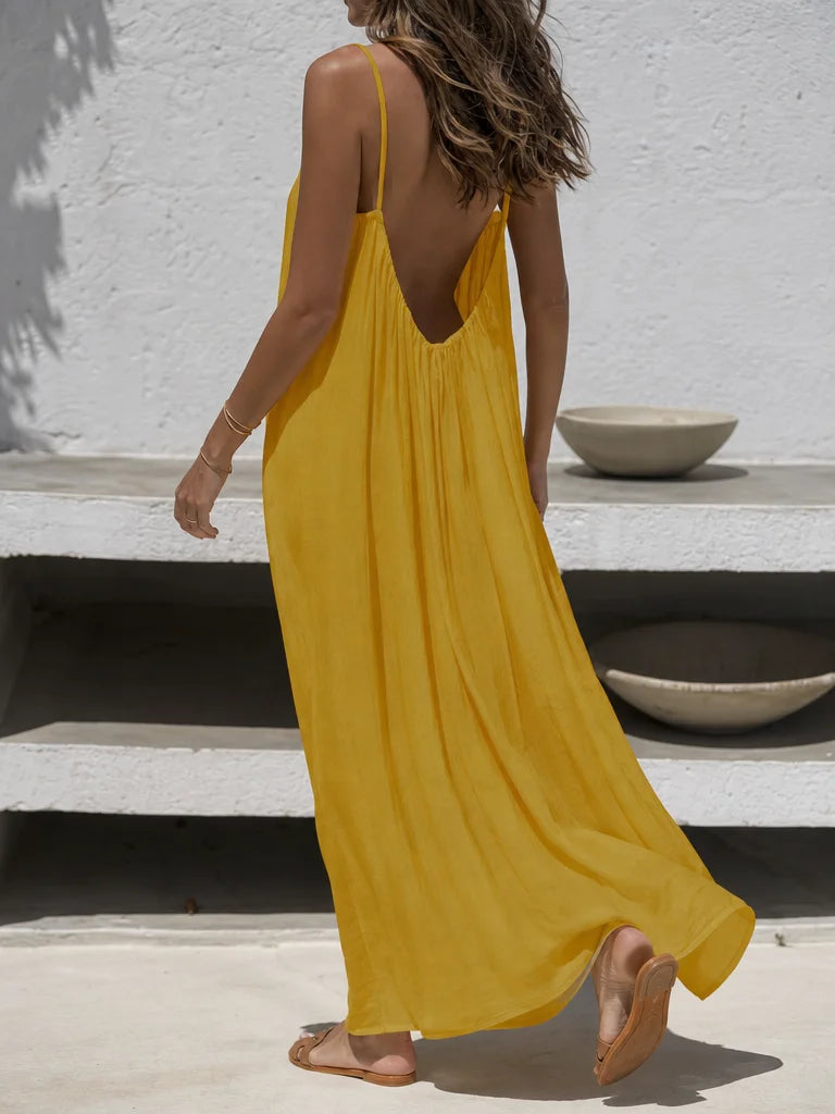 Professional fashion lookbook photograph, 3:4. The exact sourced yellow Vestido Elara from reference