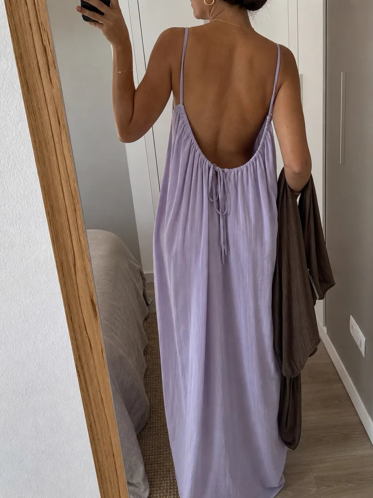 Real customer-worn fashion photograph, 3:4. Frame an over-the-shoulder mirror photograph of the exac